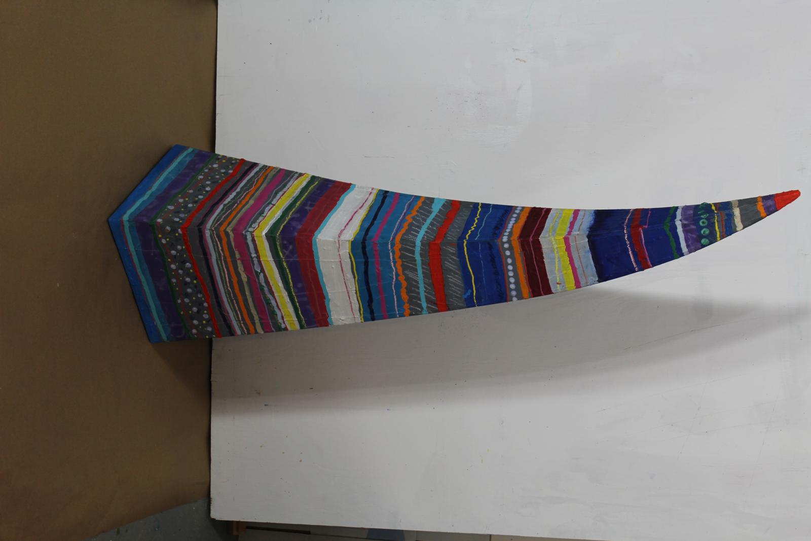 This work uses horizontal color bands in a pyramidal form to show the expressive power of color on static objects, in this case the pyramidal form. The contrast between the orientation of the concentric bands and the vertical alignment of the sculpture shows the tension between the competing forces of verticality and horizontality.