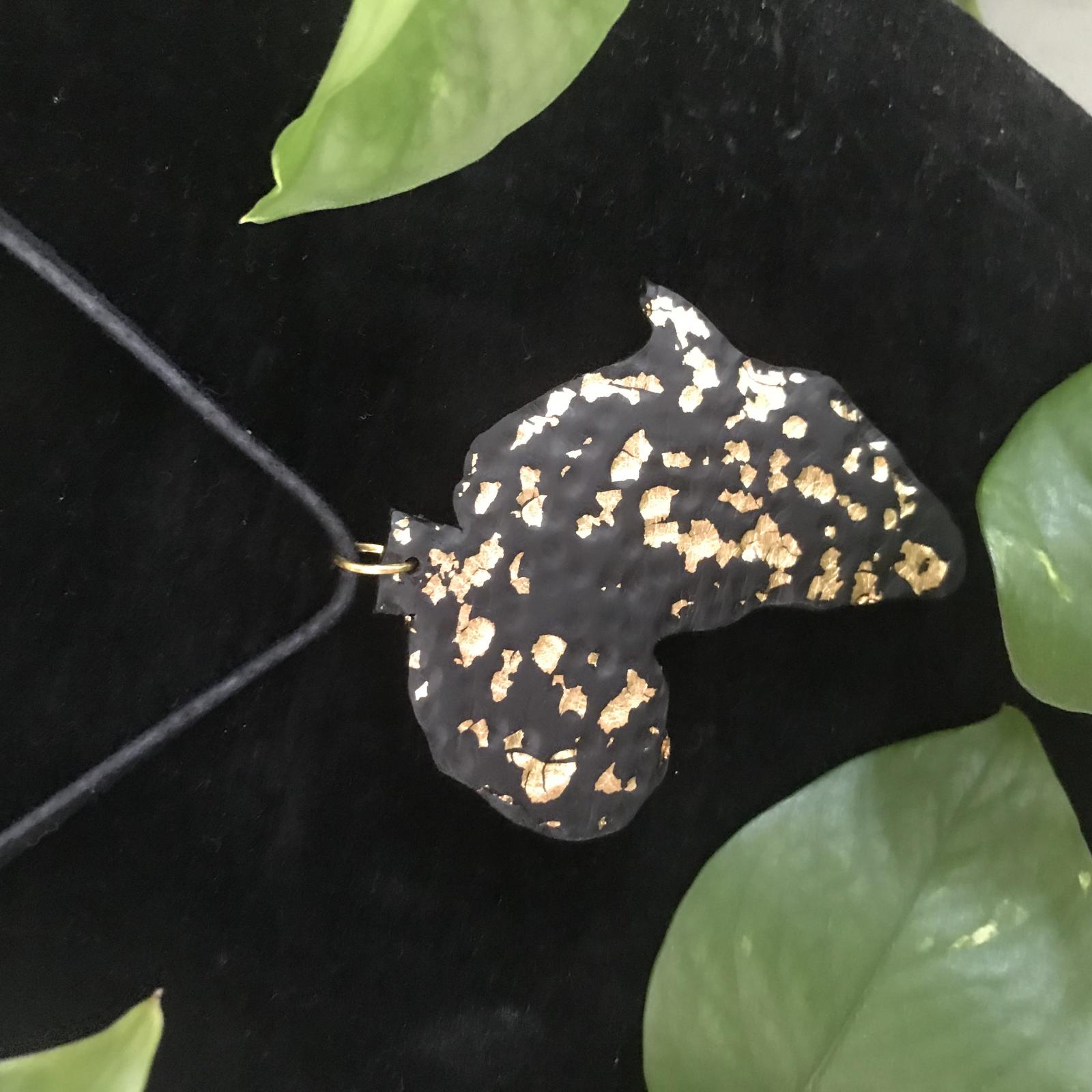 Handmade Polymer clay Necklace, sprinkled with goldleaf. This piece was textured by hand, symbolizing the  rough yet beautiful history of  Africa.