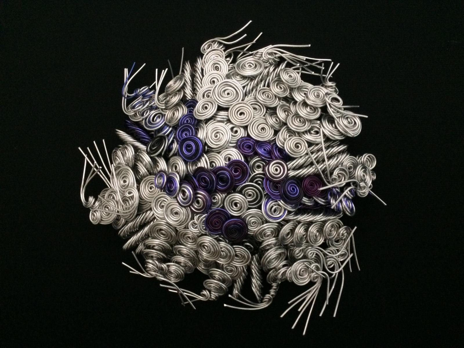 From 200-400 wire strands of various lengths and gauges are shaped and twisted into abstract sculpture.