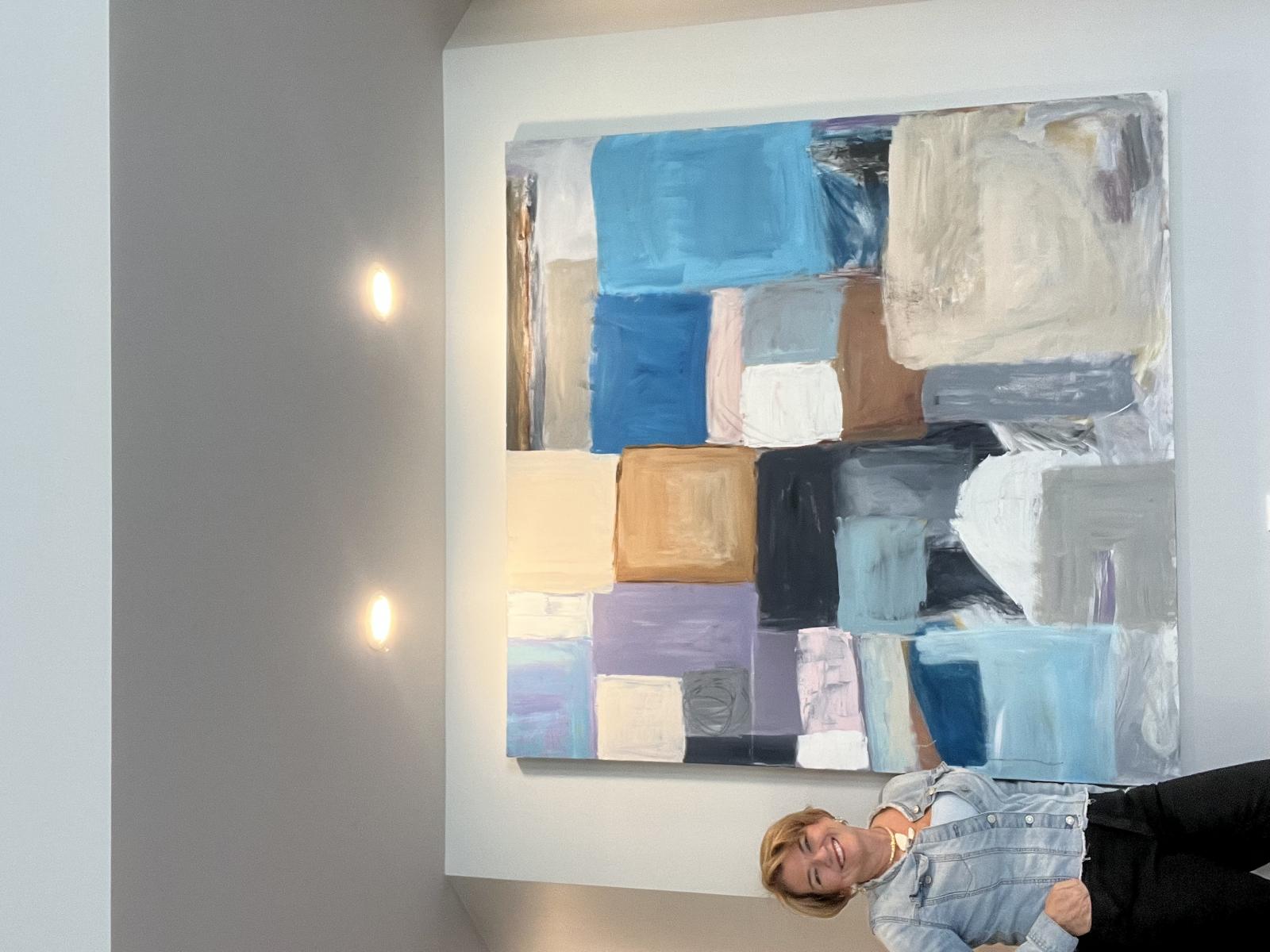 Artist Christine Zmuda shown with one of her pieces (60 by 60). More of Christine's work can be found at artgallerybyz.com