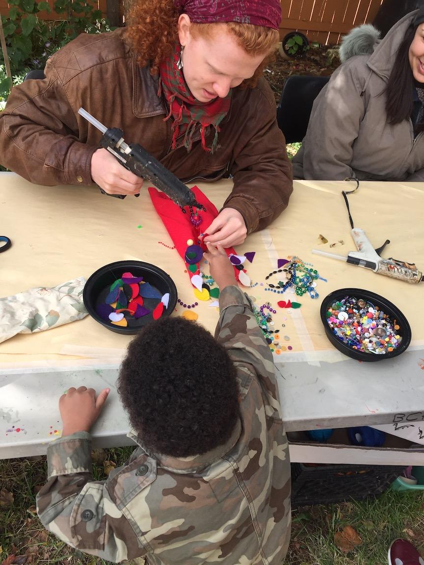 Black Cherry Artists make puppets with neighborhood children.