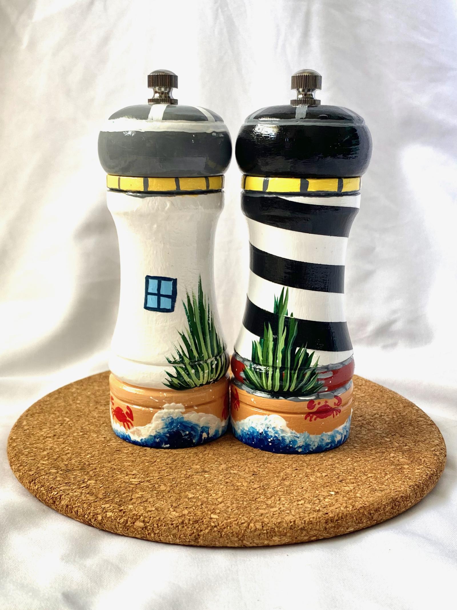 This set is painted in the likeness of two popular lighthouses, Cape Hatteras and Ocracoke Island in North Carolina. My new “universal” salt and pepper mills have a ceramic grinding mechanism that is suitable for coarse salt and pepper corns. I offer four different lighthouse designs,  so you can mix and match any two to make a set.
