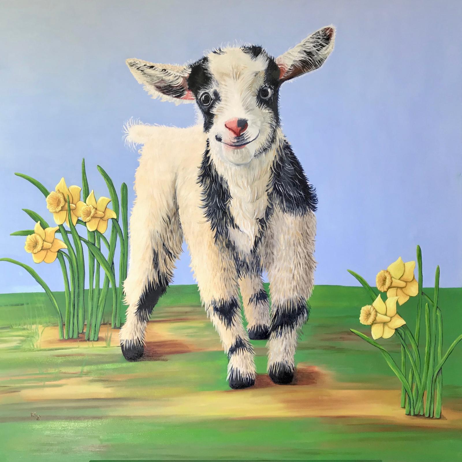 A bright and cheerful smiling baby goat lovingly named Spencer