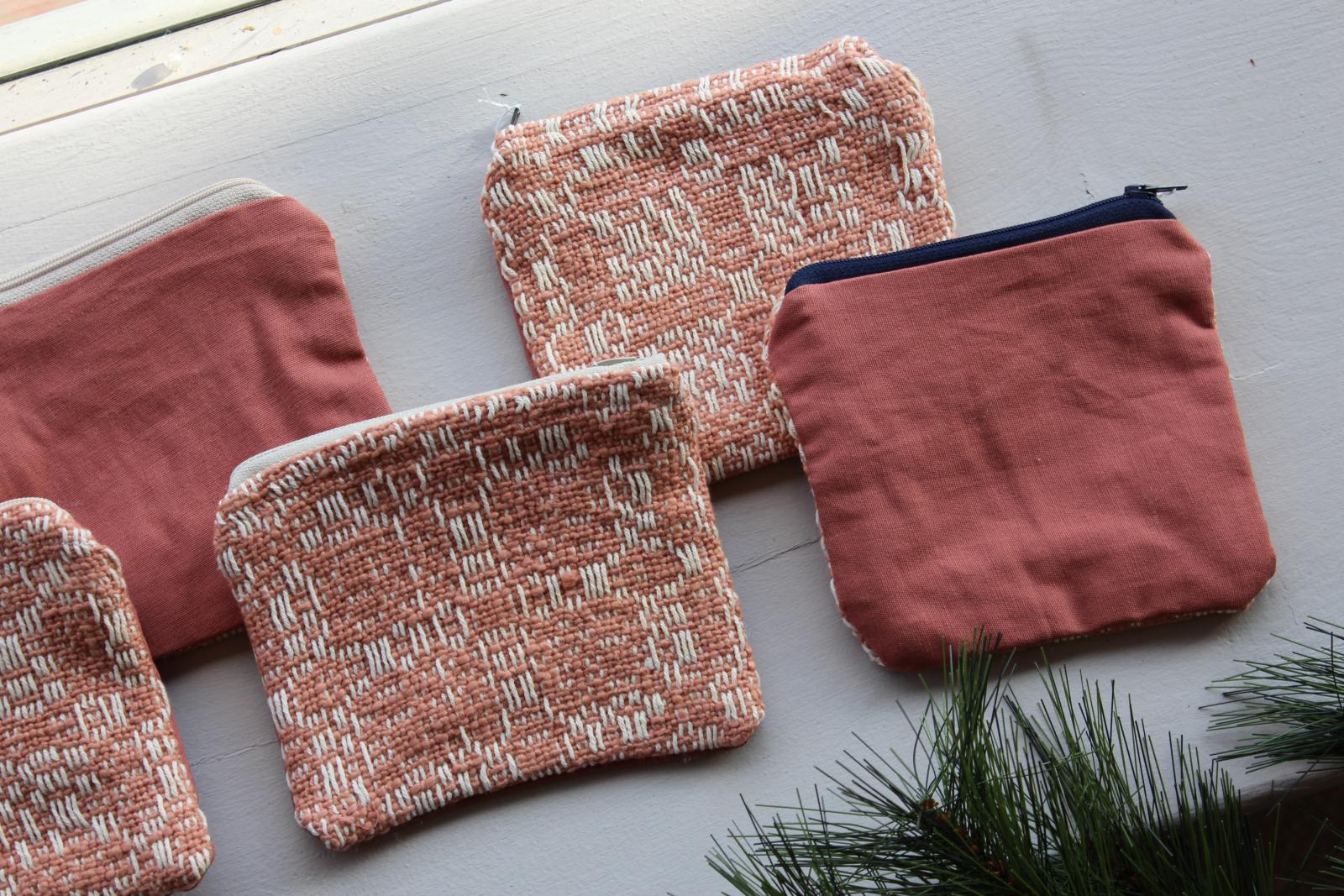 This zipper pouch is constructed from handwoven cloth and features an overshot design. Each one is fully lined; perfect to use as a travel kit, or to hold pens and pencils, cosmetics, or really anything else! 