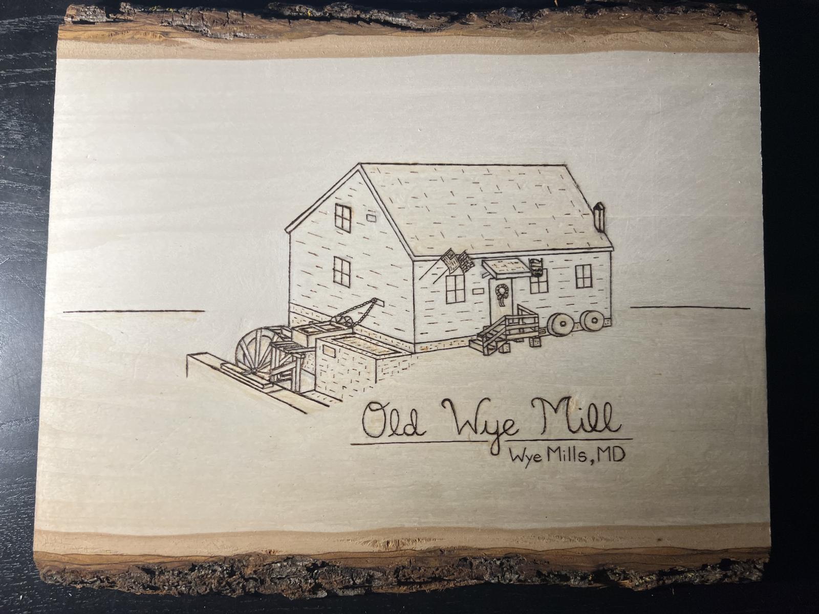 This hand burned piece of basswood features an image of the Old Wye Mill on Maryland’s Eastern Shore.