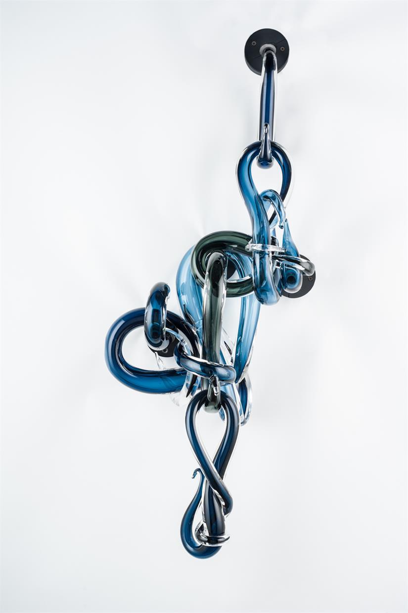The Blue Fine Line comprises of 10 separate blown pieces that fit together to give the illusion that the piece is intermingled. Pieces are blown, formed, polished and the wall composition developed.