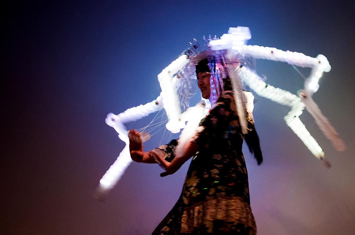 Revealuxion is a personal, artistic performance using an experimental, interactive, wearable garment that is connected to my brainwaves. My concept concentrates on self-esteem, self-portrait, aesthetic emotions, and human connection. I express my internal feelings and emotions in front of audiences through the garment, which means I will reveal my true self instead of a version of myself that is fake, sealed up, or hidden behind technology. Ultimately, I aim to find ways to reach catharsis, with spectators, through empathetic engagement.