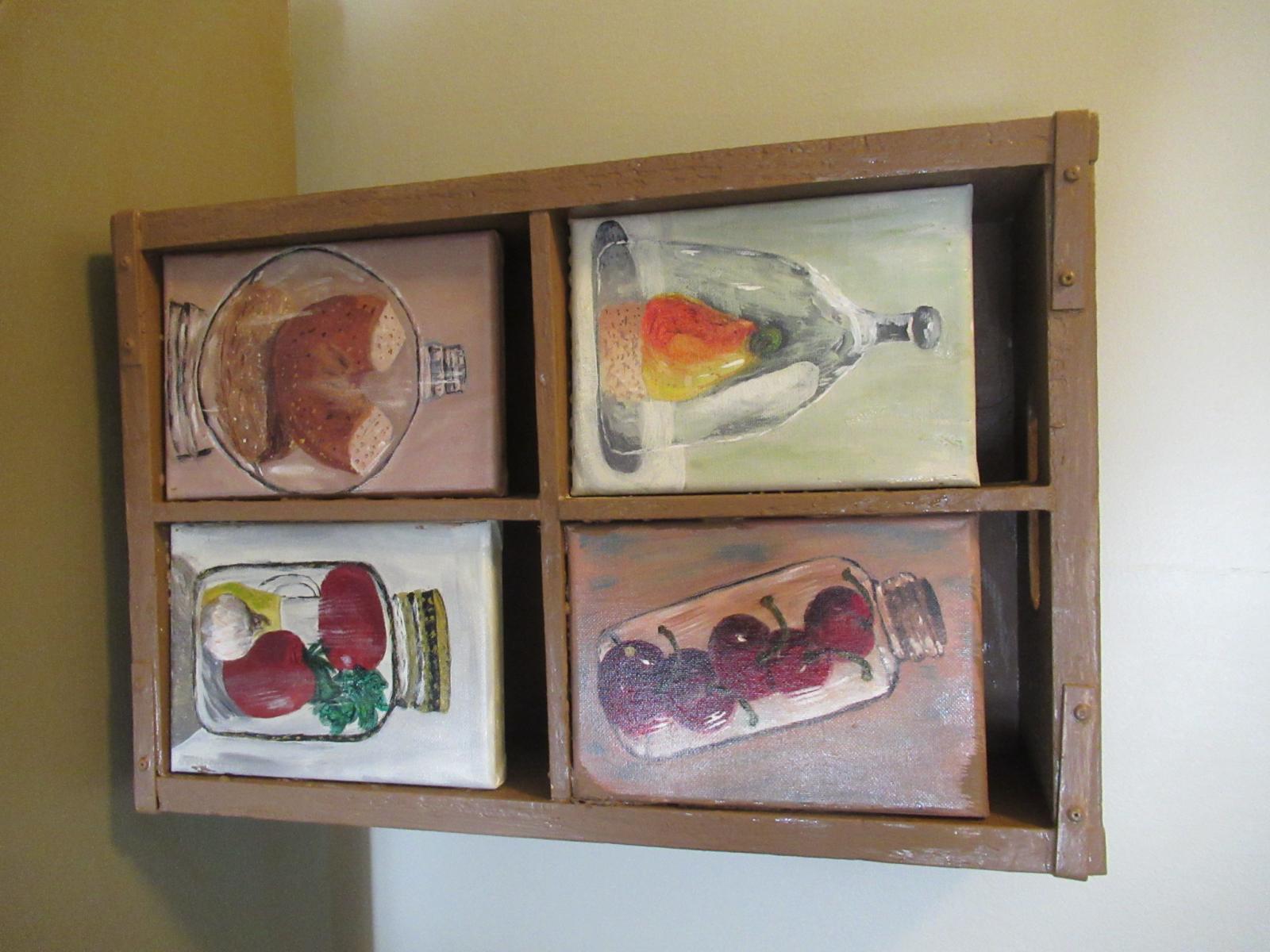 Atypical contents in various glass receptacles framed in painted vintage bottle box