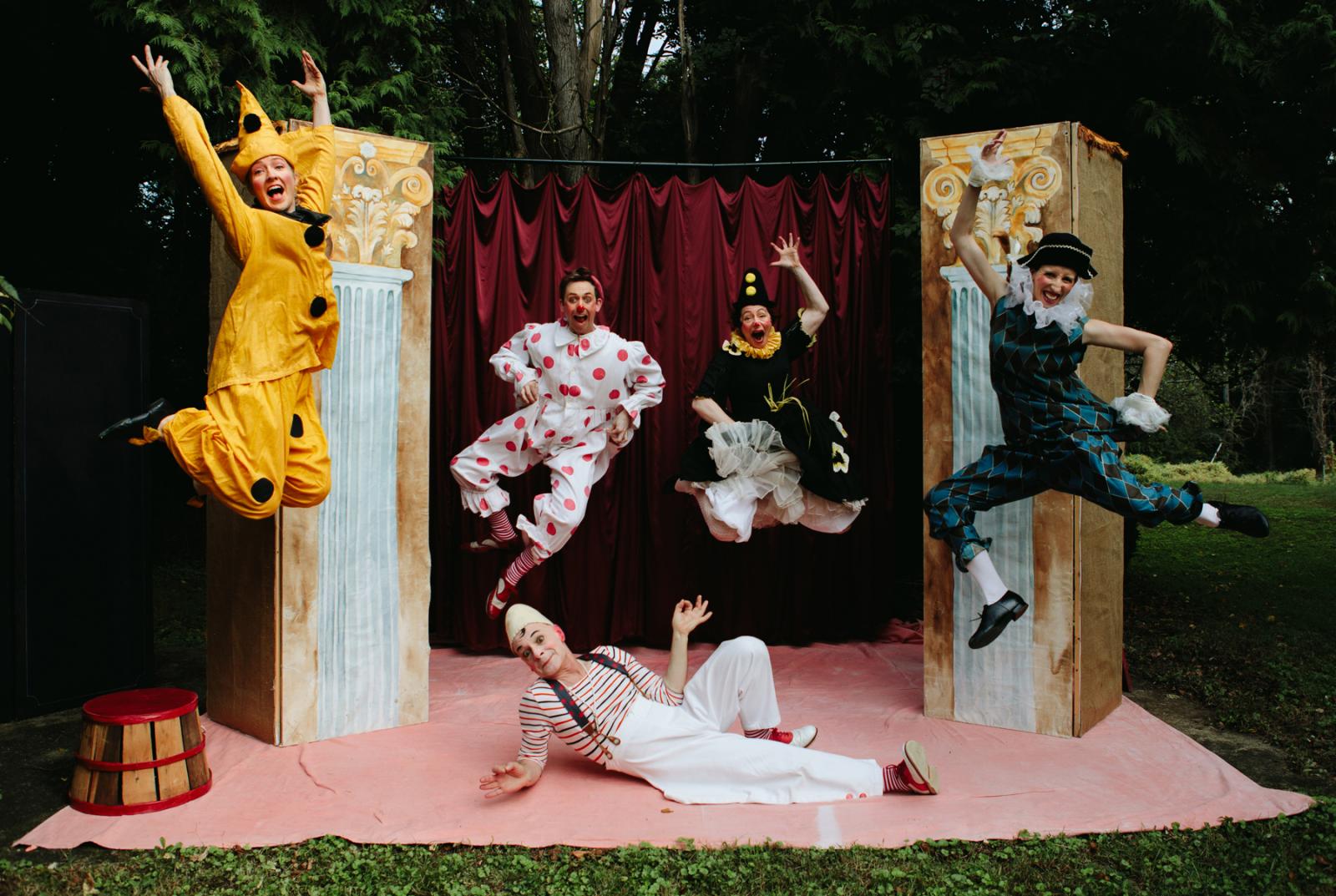 5 Clowns leap and play.