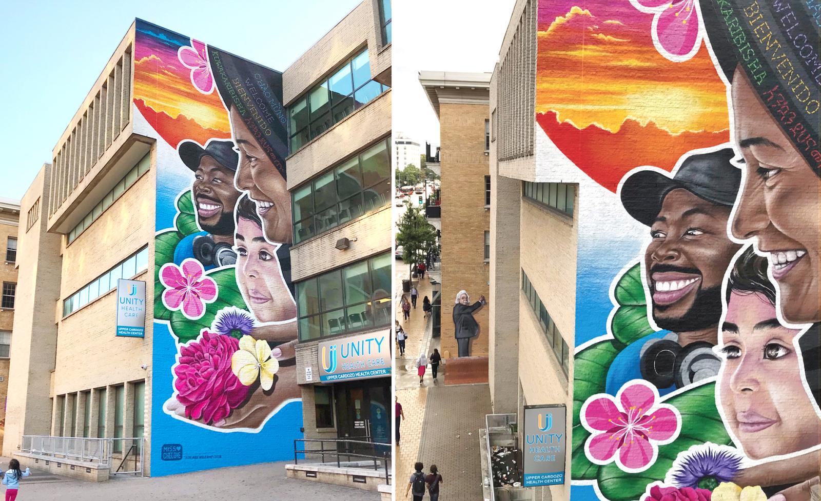 “You Are Welcome” is an exterior mural located in Columbia Heights at Unity Healthcare’s Upper Cardozo location, 3020 14th St NW, Washington, DC 20009. This mural was painted in the summer of 2018 for the MuralsDC Project. 

A multi-ethnic, multi-generational composition meant to uplift and brighten those who are coming to Unity Healthcare's Upper Cardozo location, a bustling community health clinic in the Columbia Heights neighborhood in Washington, DC. This exterior mural reflects the over 30-year-old organization’s commitment to serving all - refusing care to no one. A Safe Space where all are welcome. A place of positivity where hope and bright futures can be realized. 

Set in the foreground of a grand sunset, a grandmother makes an offering of a handful of glorious blooms as her granddaughter smiles. The rose symbolizes promise, hope, and new beginnings. The purple thistle is a symbol of an enlightened person - one who has gained their crown. The color purple also symbolizes dignity, which every patient coming to Unity Healthcare deserves.

Many of the patients who come to this clinic have roots in Central America, Africa, and Asia. In Grandmother’s shawl, the greeting “Welcome” is stitched in 5 languages: English, Spanish, Vietnamese, Swahili, & Amharic. These linguistic touch points are meant to spark a familiar connection for these folks and will hopefully help them feel as if they, too, belong here. This detail is not meant to have major prominence, but rather something to be recognized over multiple visits.

* Welcome
* Bienvenidos
* Chào mừng
* Kuwakaribisha
* መጣችሁ (Met’achihu)

Nature cradles a young black male figure, with leaves creating a solid base of protection. A vibrant cherry blossom echoes the shape of a “crown” extending beyond his head, projecting the image of a regal figure who is supported, protected, and valued. To the Japanese, the symbolism of the cherry blossom is tied to themes of mortality, mindfulness, and living in the present, a powerful metaphor for human existence.  Blooming season is powerful, glorious, and intoxicating, but also short-lived — a visual reminder that our lives, too, are fleeting.