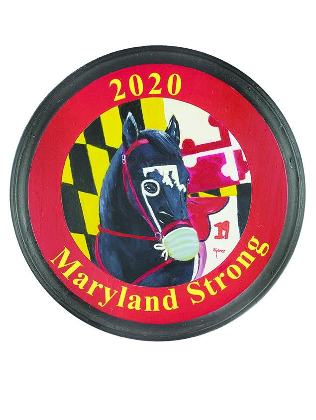 Maryland Strong is a commemorative original oil of a Thoroughbred rescued at her last stop before euthanasia because she was the "Horse that nobody wanted". She was adopted, nurtured for over a year, and retrained. She is used in Maryland Strong to represent the struggle of Covid 19. She has the Maryland map as her blaze, a mask to represent our efforts to protect from Covid prior to vaccine development, the number 19 on her saddle pad and a monocle allowing the horse to be the spectator. This was the year Pimlico was postponed from its traditional April run. The race ran in October with no spectators short of the horses.