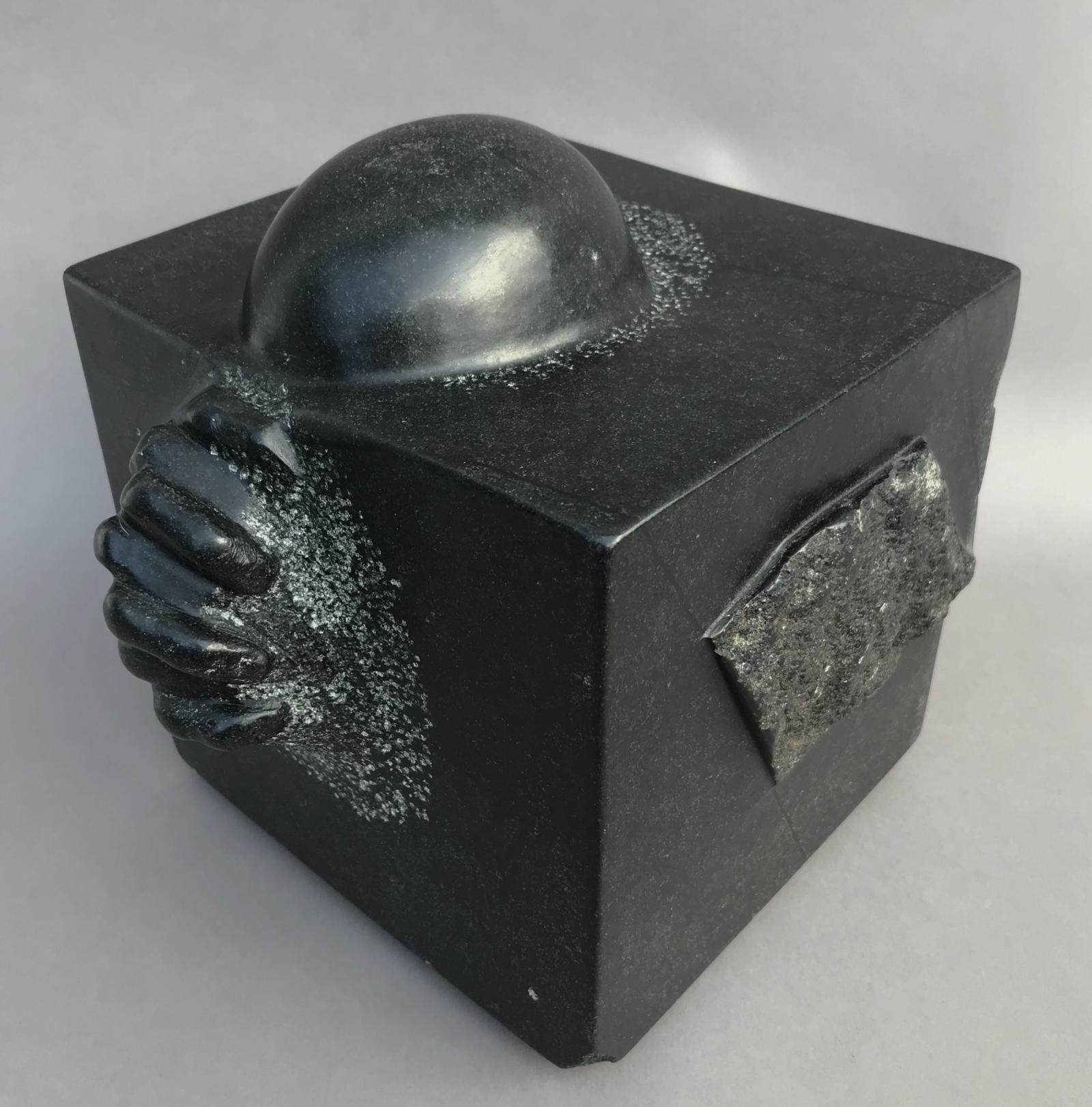 Carved and polished black soapstone.