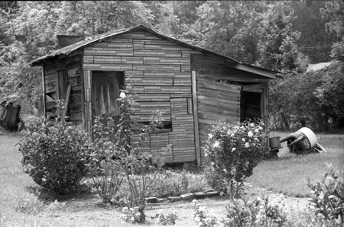 House with washing machine in yard
