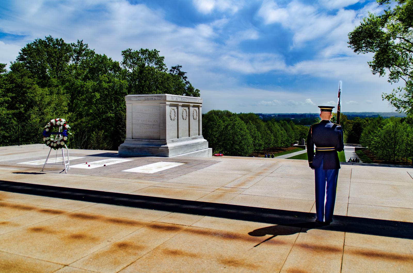 A soldier standing guard over the Tomb Of The Unknown Soldier at Arlington National Cemetery.