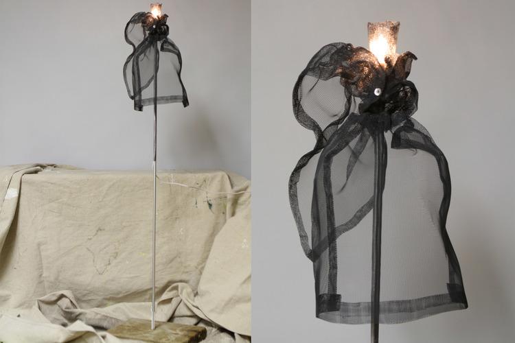 Lightheaded Woman was created out of window screen, Ikea curtain pull, Virginia Beach driftwood, christmas house light, and ductape with a touch of humor in the title; dedicated to all of us with women’s logic.