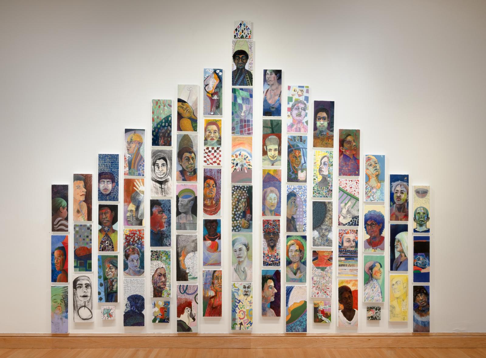 Painted Stories is an installation of 60 mixed-media portraits built as a large structure. Most portraits feature real people and each portrait has a story written on the back of the panel.
A sample story: "Another Saturday painting Jenn in her butterfly dress, sitting so calmly, no boys, no noise. I added 'hydrogen', the first element, to Jenn's portrait. Her home life was, from the telling of it, like a time bomb... highly flammable like hydrogen. Somehow, she balanced those realities... the calm, the ticking bomb, and the butterfly.”