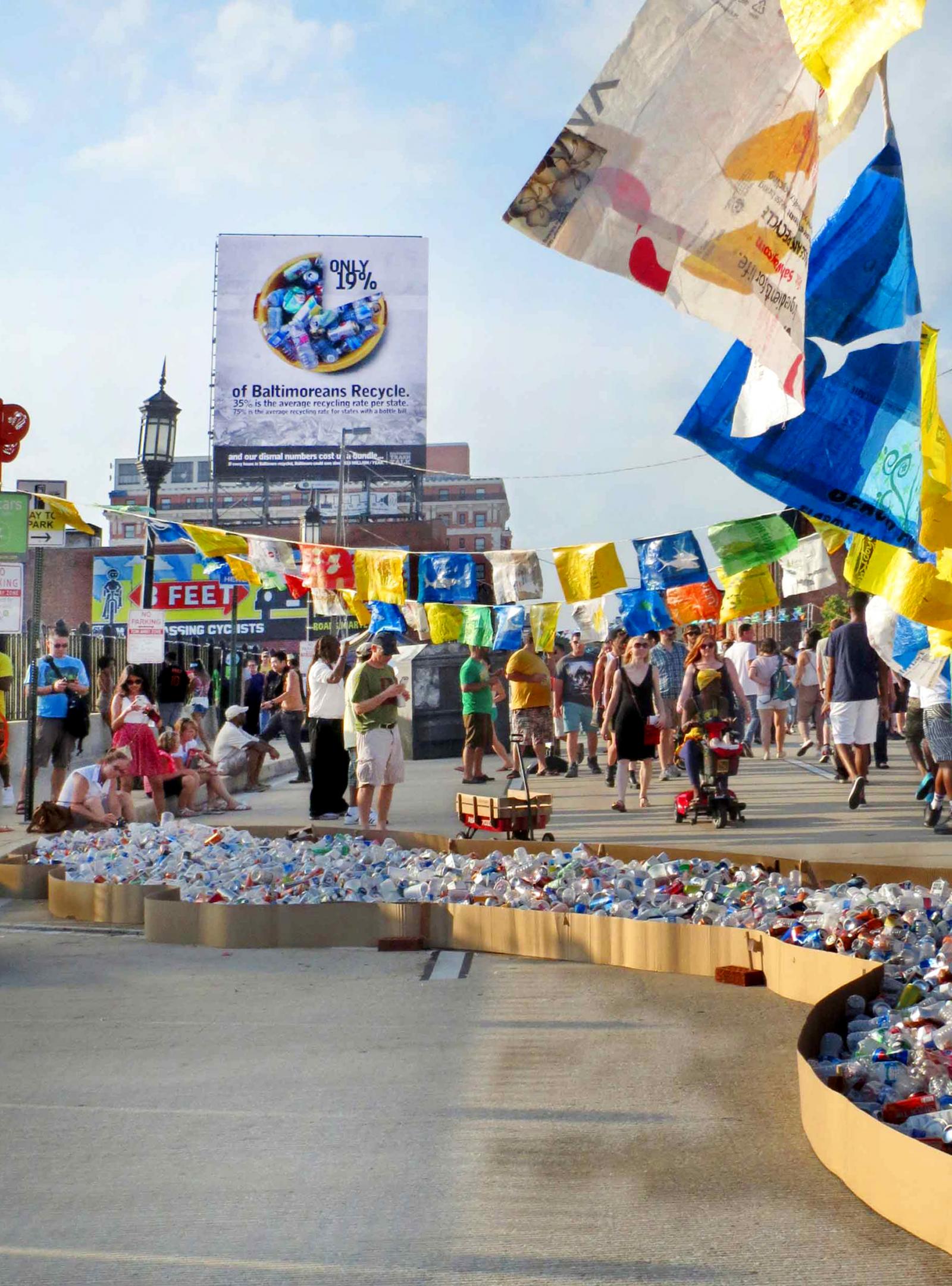 Artscape exhibtion of recyclable items pulled from the trash and recycling at Artscape. River was accompanied by 100 plastic bag flags with silhouettes of sea creatures cut out of them.