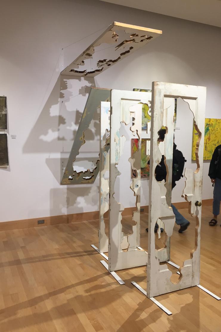 Pass Through revolves around my interest in the narratives of abandoned objects. Doors are passageways leading from one place to the next, and without their context are almost void of meaning; of identity. Objects like these often end up on the sides of roads, as trash, or as salvaged materials for reclaim. This installation focuses on my interest in the narratives of abandoned objects. In Pass Through, I attempt to return a sort of dreamy or supernatural vitality to various interior/exterior doors. 