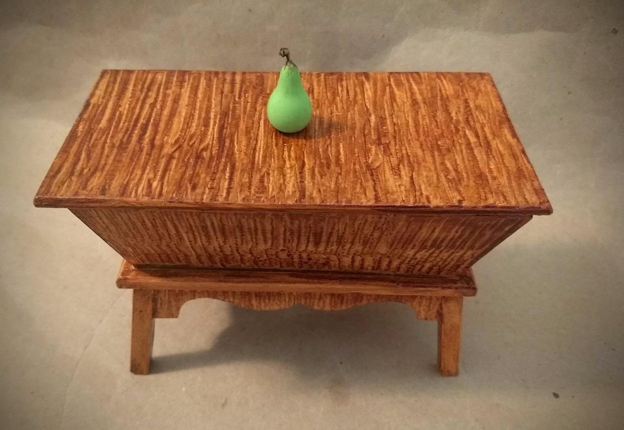 Small box which I have vinegar grained with a tiny wooden pear that is the knob to lift off the top.