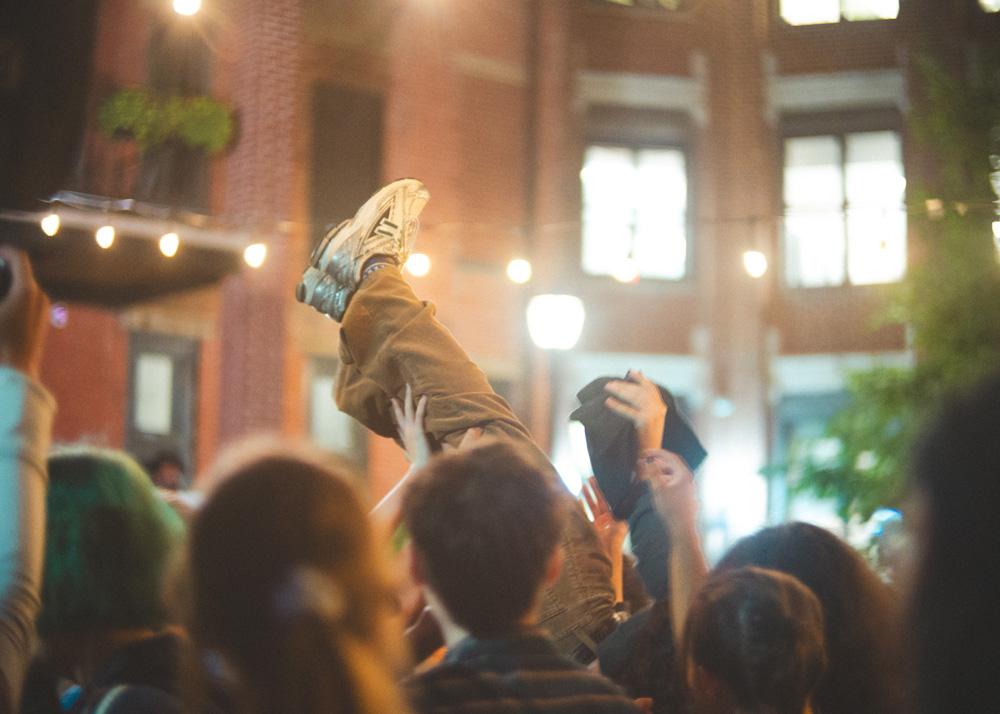A crowdsurfer at an outdoor concert in Philadelphia