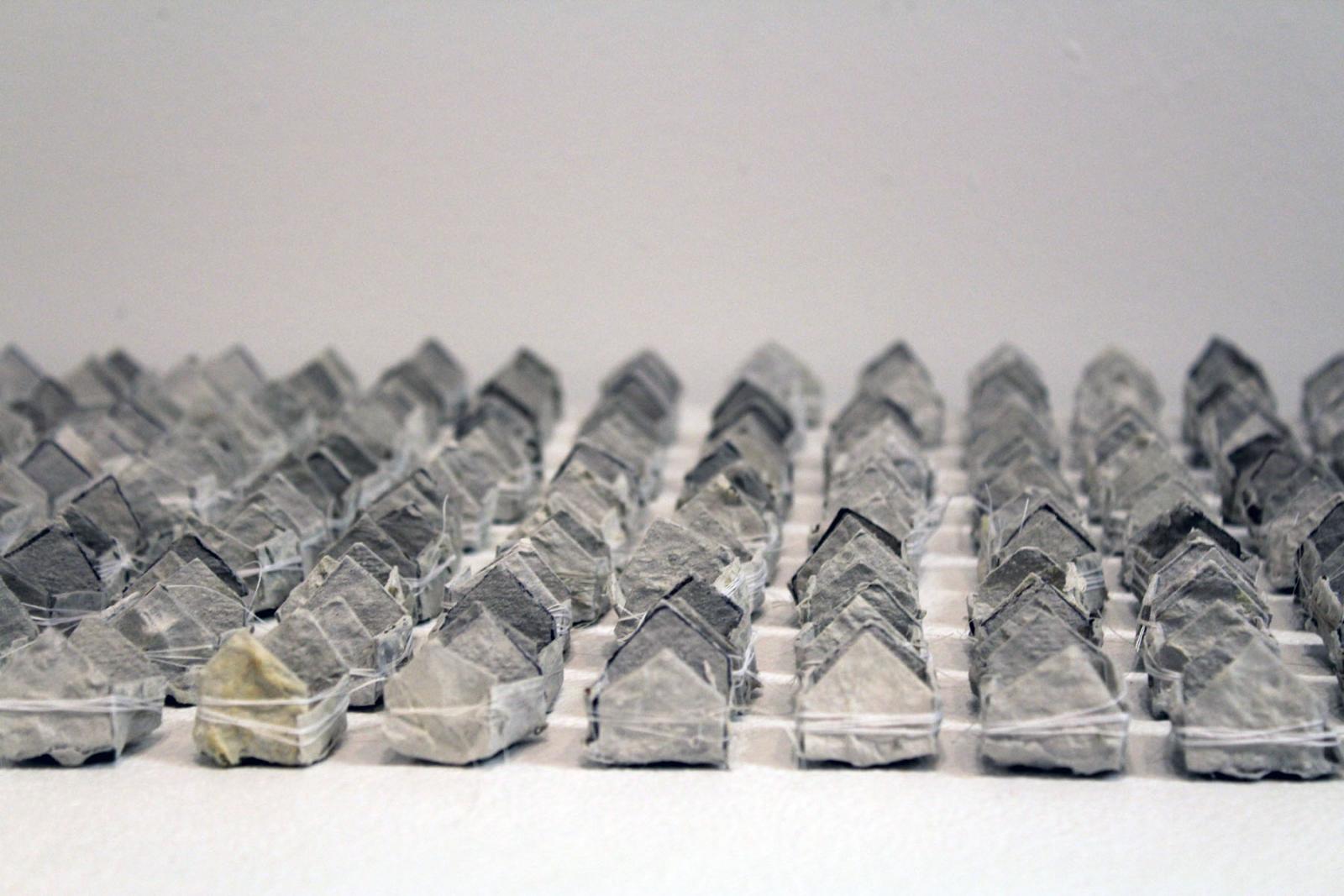 A monument developed through conversation with East Baltimore environmental activist Glenn Ross. Built from seeded paper, the households are to be placed where families' homes once physically stood.
Imbued with hearty perennial seeds, the homes are meant to sprout, and resprout, rooting in when the human beings they represent were uprooted. An ever-present and re-emerging reminder of their lives.