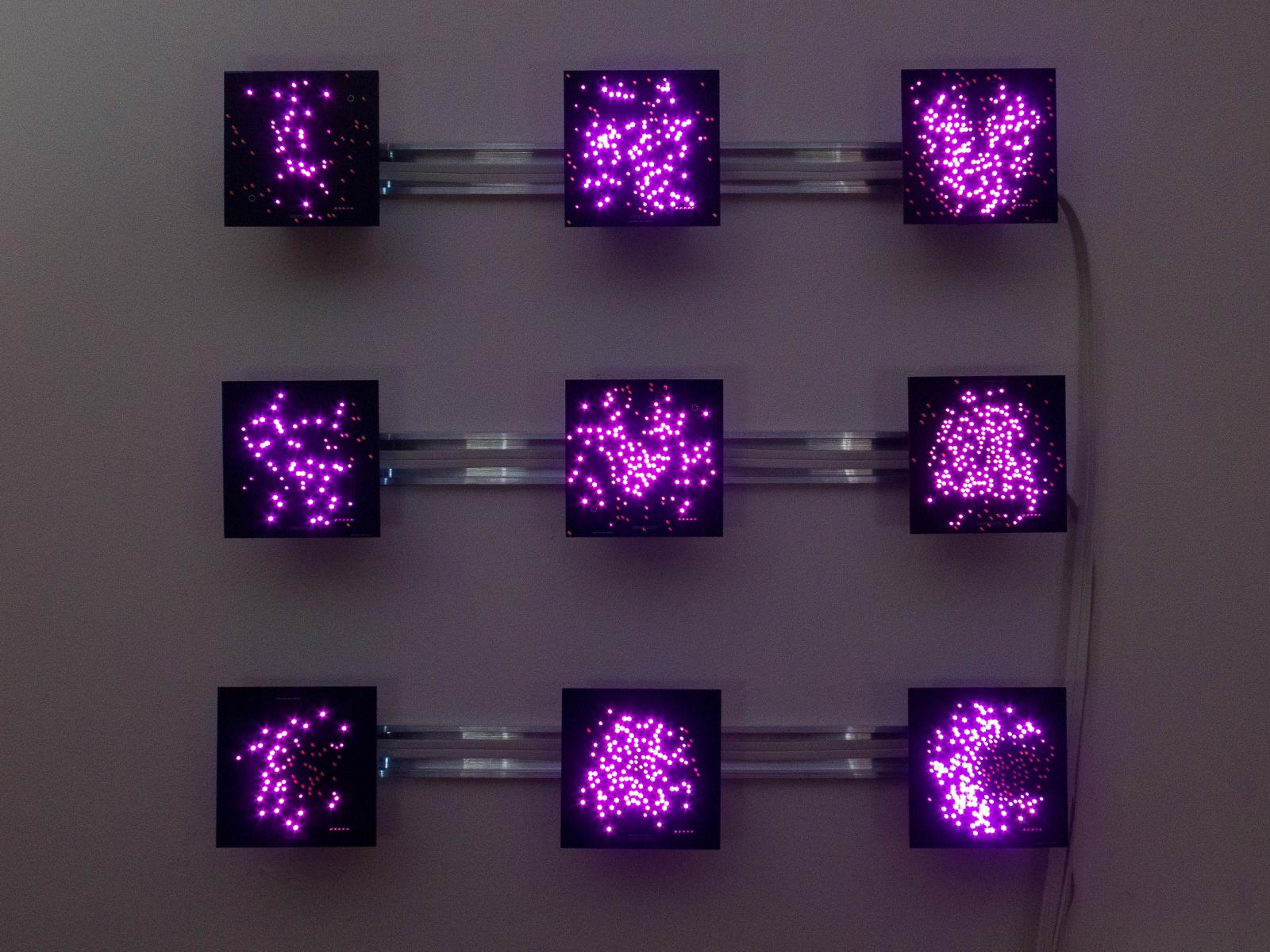 Time-based: This artwork shows a succession of letters on each of its nine panels. The letters piece together into messages like, “S-E-N-T Y-O-U A M-E-S-S-A-G-E O-N F-A-C-E-B-O-O-K”… The panels communicate with one another and periodically synchronize with startling animations.