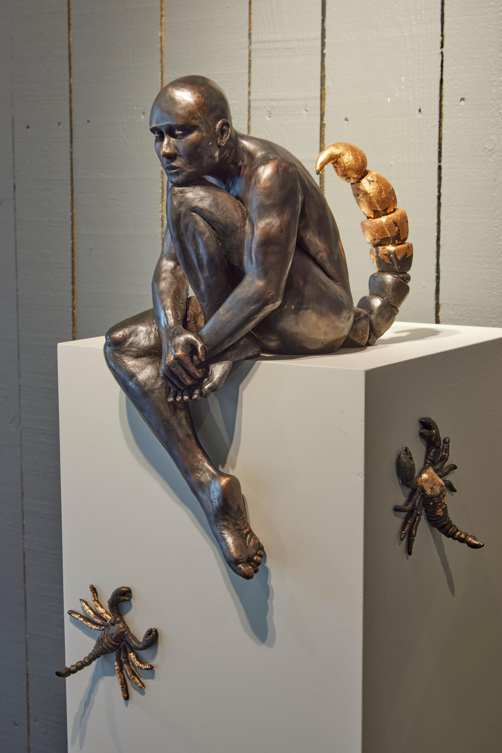This sculpture tells the story of a figure preparing for battle against the world’s challenges. Armed to face external enemies, the figure ultimately confronts a moment where the weapon may turn inward, reflecting the complexities of struggle and self-defense. Surrounding the figure, smaller scorpions symbolize the many external adversaries it faces, highlighting both courage and the delicate balance between confrontation and vulnerability. The piece captures the tension between strength and fragility, inviting viewers to reflect on resilience, strategy, and the inner battles we all endure.