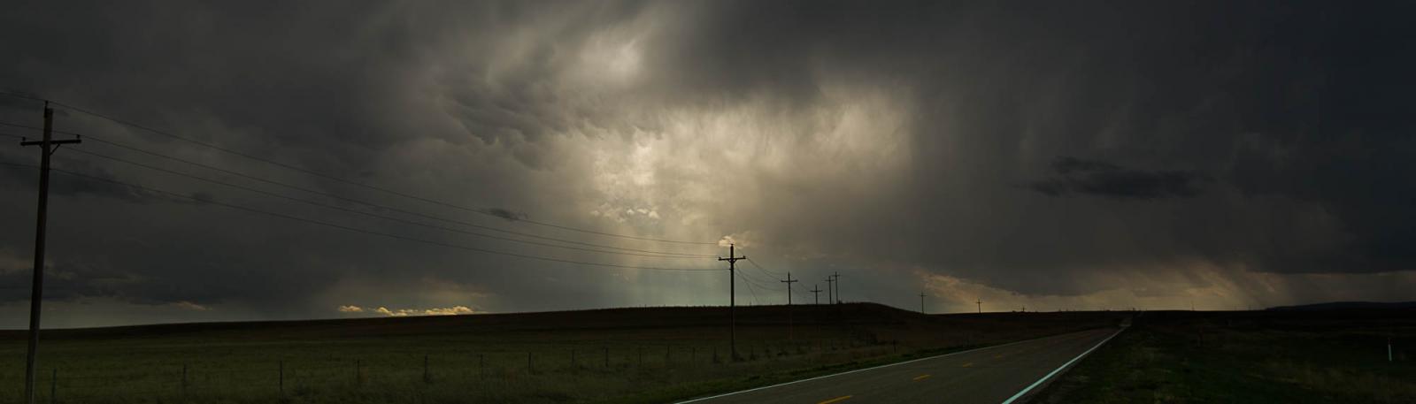 While driving alone on the empty plains of northeastern Colorado, thunderstorms began to roll off the Rocky Mountains.