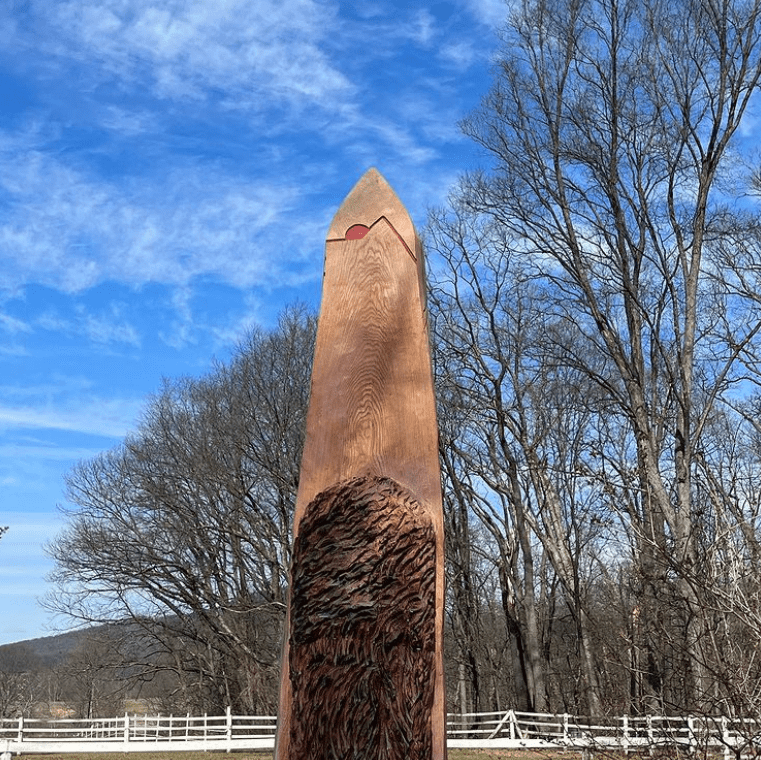 Chainsaw Carving out of a 12 foot red oak stump in Maryland.