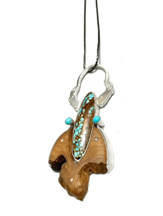 #8 turquoise, black cherry wood, and sterling silver all combined to make a marvelous pendant. This piece will be featured at the 2023 Creative Crafts Council biennial exhibit to be held at Strathmore Mansion in Bethesda, Maryland from May 9 to July 29, 2023