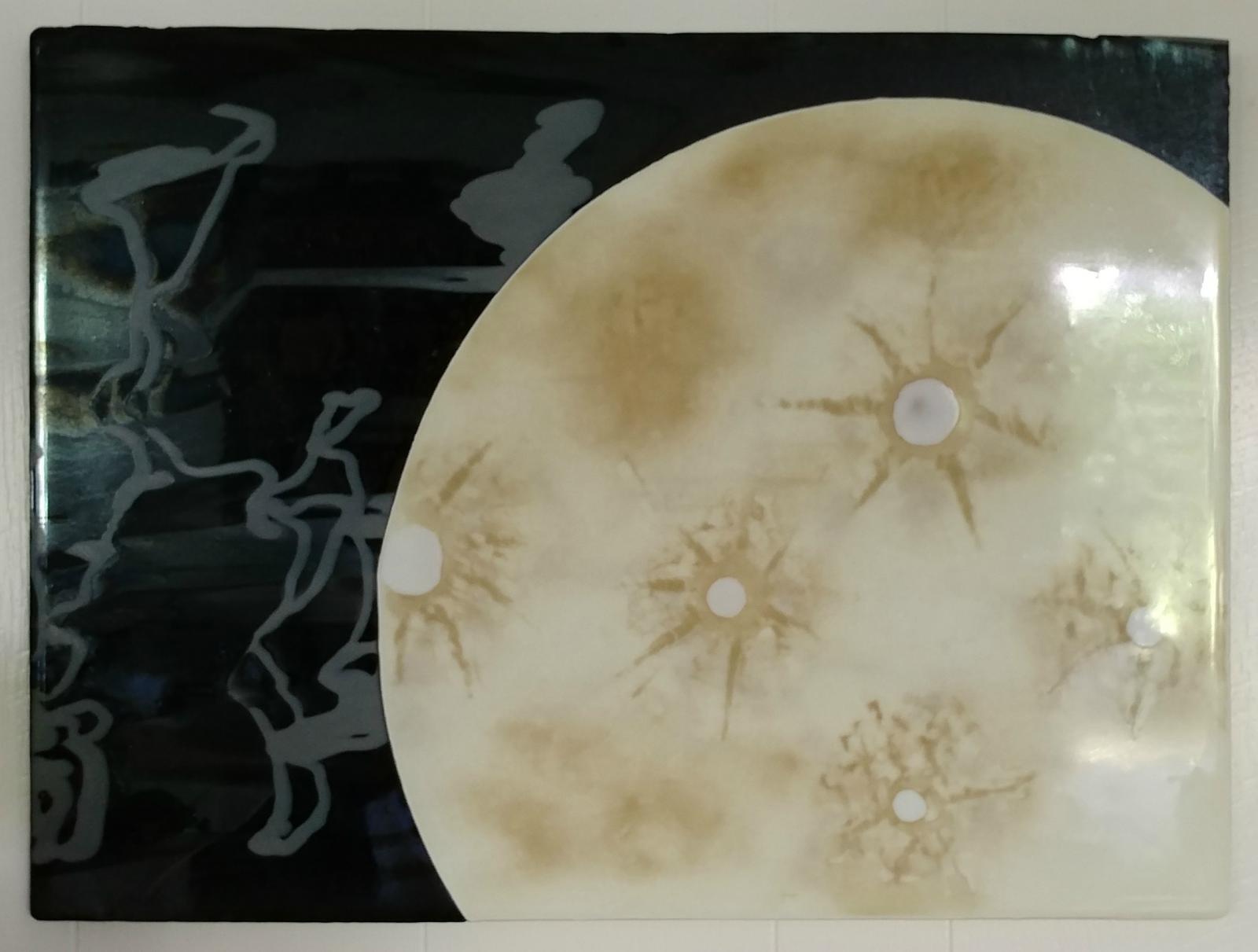 fused glass wall hanging depicting an otherworldly moon
