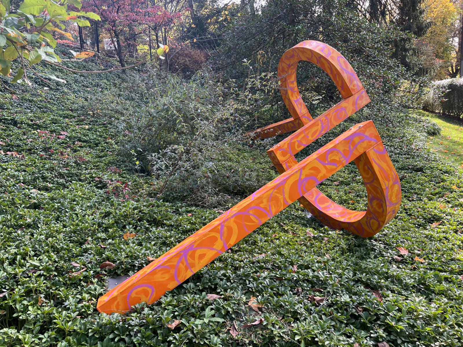 Split Circle is part of a body of work created during the seventies and reimagined recently by the artist. The initial concept for the work was the counter-play of the welding process rough bead and iridescent coloration of the steel with minimal forms.
The new iteration layers the artist’s more recent exploration of her painting process with application of a base coat and painterly brushwork over the original work. Further, the new marine aeronautical coating enables the work to endure weather conditions over time.