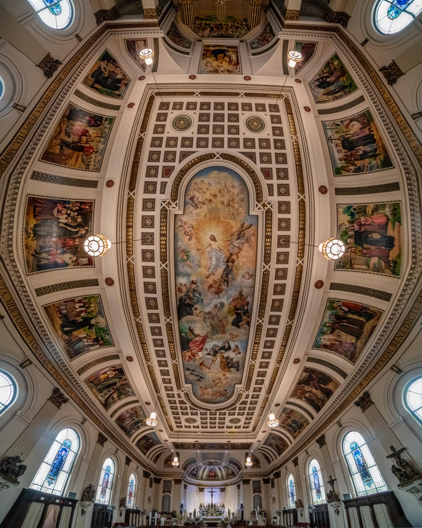 Interior vertorama of St. Casimir Church ceiling art, from alter to organ pipes.