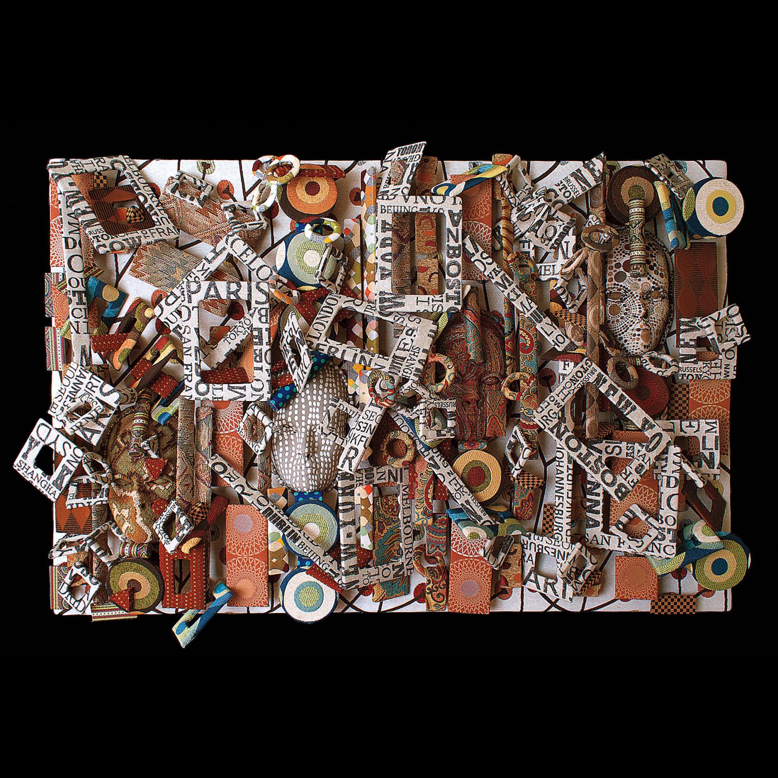 Fabric stretched over a rectangle shaped wooden frame, layered with additional fabric covered embedded faces and mixed media.