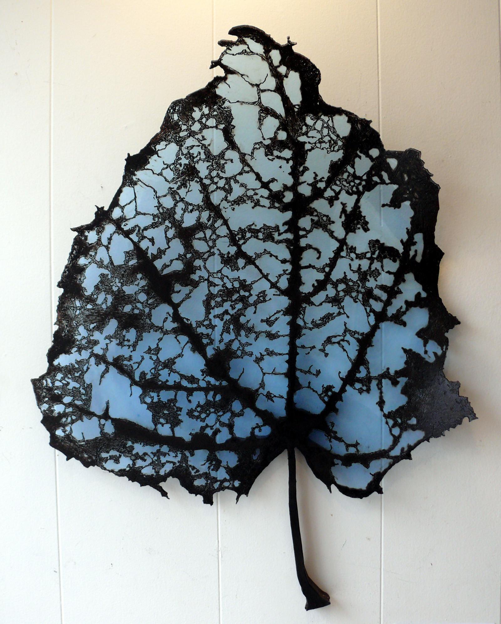 Wall hung sculpture depicting the transformation of a leaf as it decomposes