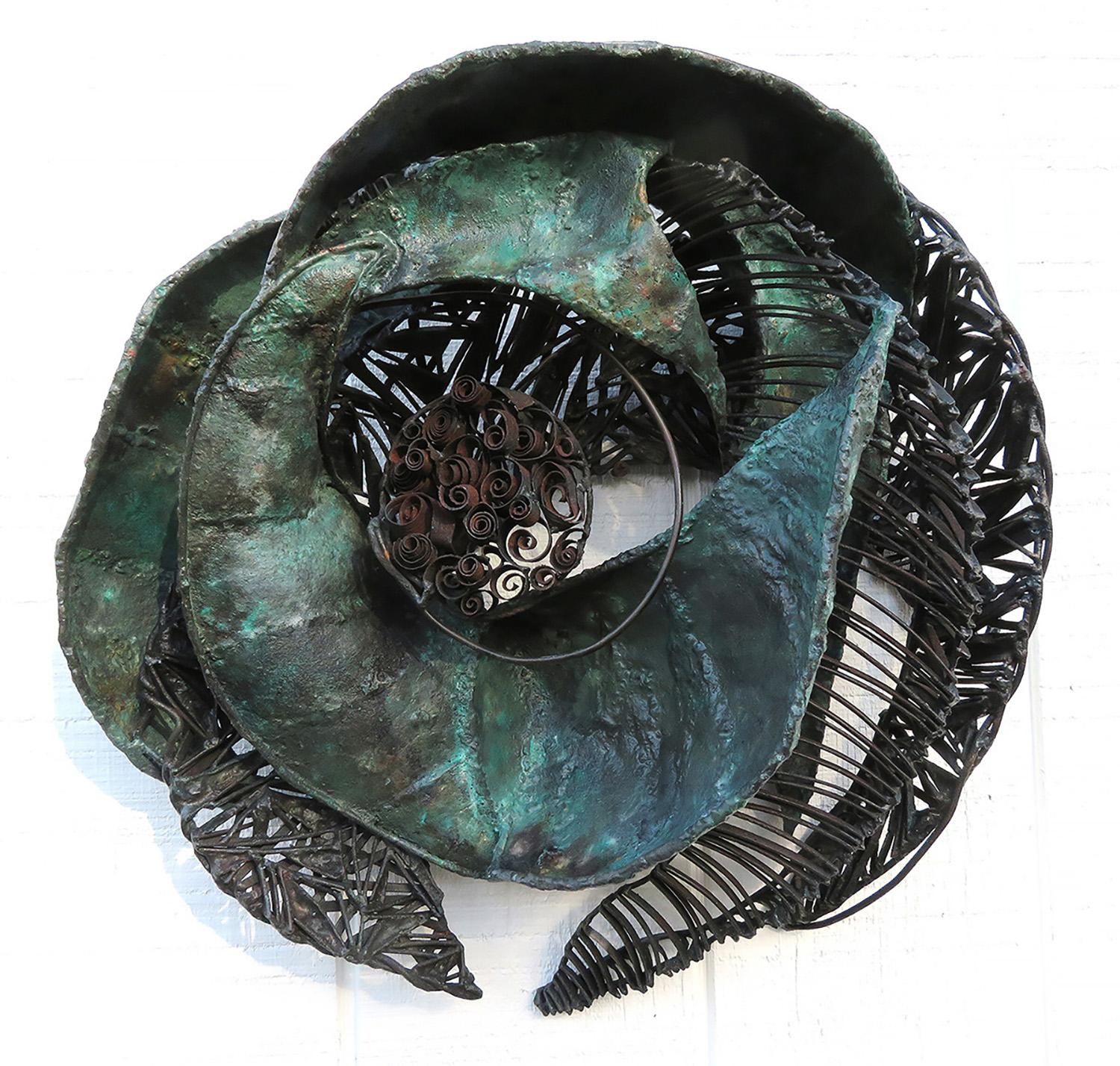 Turbulent is a piece about passage, transformation and movement. I use the various weights of steel and welding techniques to draw your eye around the piece. The patina is heated with flame using subtle color to give a a feel of antiquity.