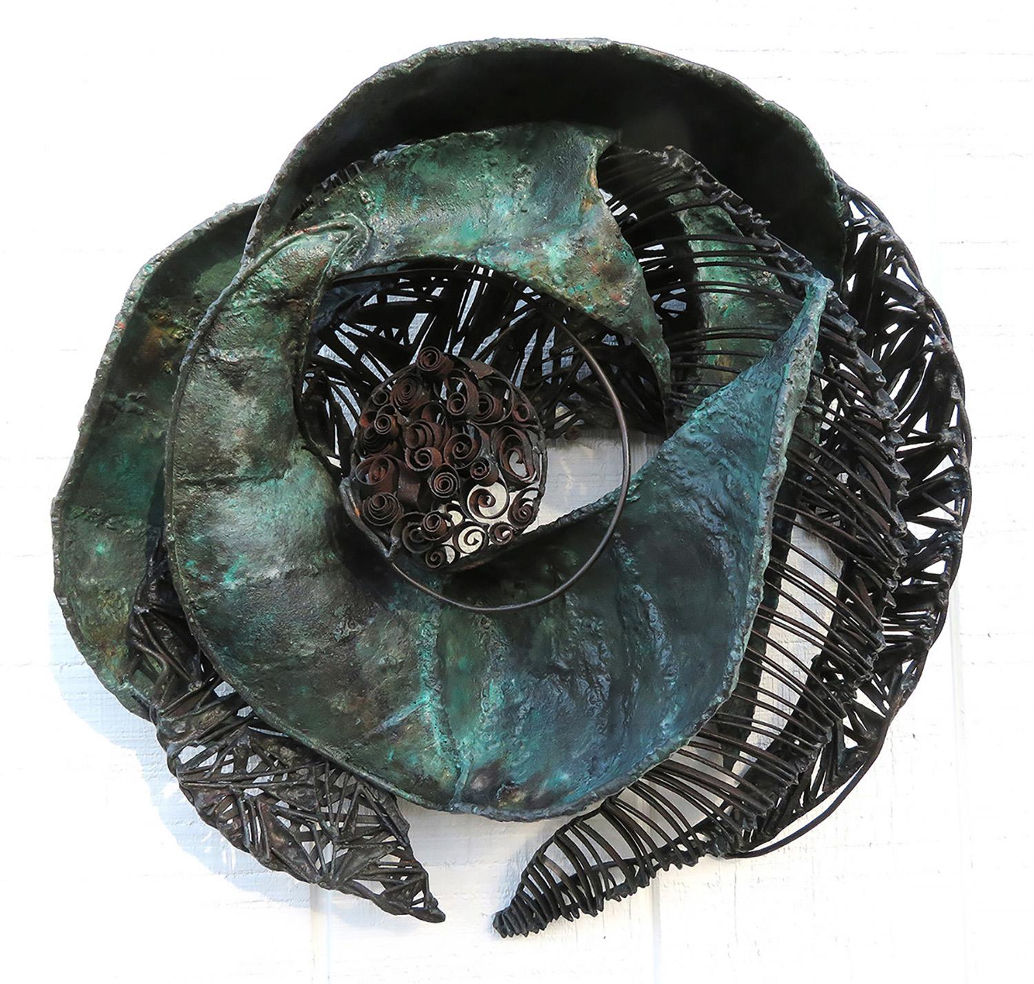 Turbulent is a piece about passage, transformation and movement.  I use the various weights of steel and welding techniques to draw your eye around the piece. The patina is heated with flame using subtle color to give a a feel of antiquity.