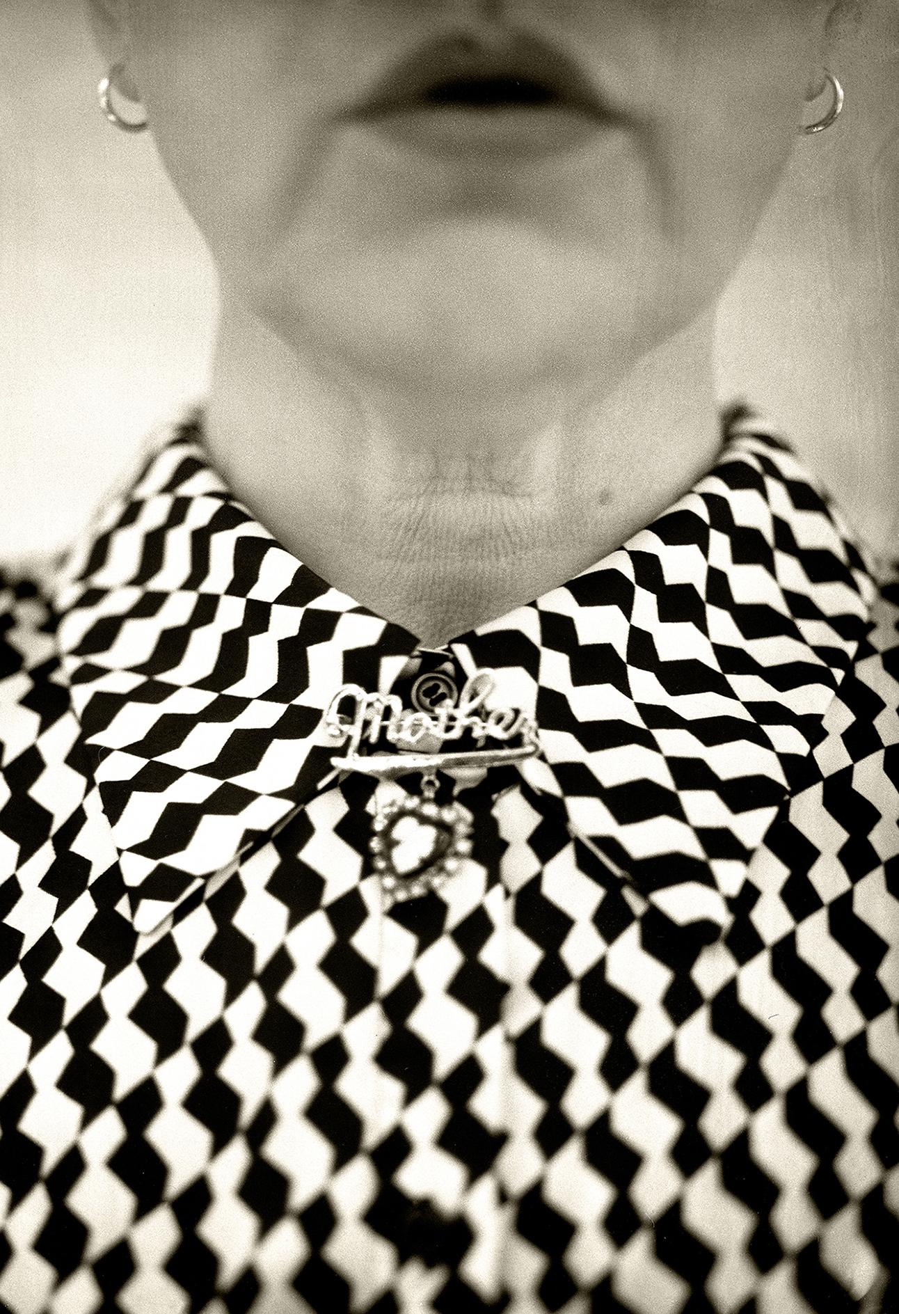 Cara Lee Wade’s photographs are stitched from the fabric of matriarchal memory through objects once held, places once known, and stories told. Through self-portraiture and the act of performance, she becomes both a witness and a vessel for the women who came before her, weaving familial artifacts, not as fixed truths, but as living, breathing echoes, where what is absorbed, altered, or lost is made visible again.
What began in mourning has become ritual. A story passed at the supper table, or a dusty teacup found in an antique store might spark a new image. Loss has ignited in Wade a commitment to absorb, preserve, and gather what remains, the stories, pieces, and  places holding them close before they, too, disappear.
Photographs are made with a 1947 4x5 Graflex and printed in small archival editions, each a tactile response to the fragility of remembrance.