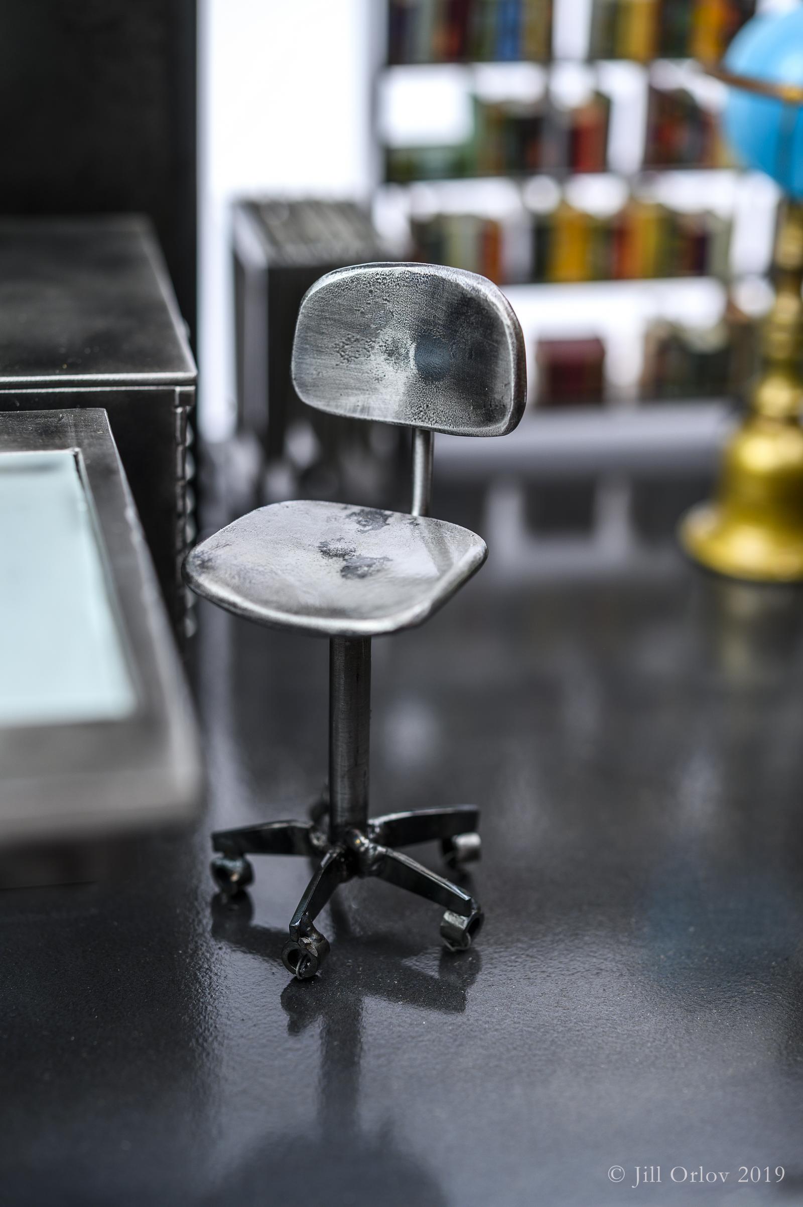 Detail of Wings of Desire vignette showing swiveling bar stool (does swivel)