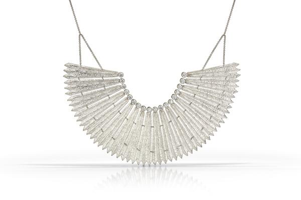 This stunning statement necklace features eighteen linked pieces, each topped with a Swarovski crystal. Each pieces is delicately textured to mimic rocky ridges.