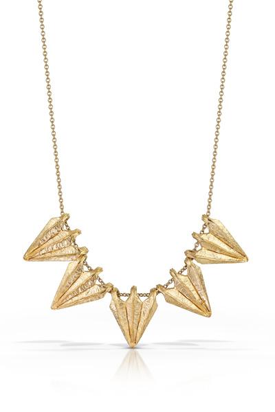 Necklace features five hanging pieces, each delicately textured to mimic three converging rocky ridges.