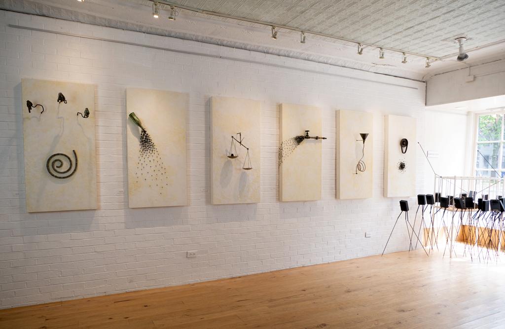 2020 Installation at NOMA Gallery, Frederick, MD. The work exposes the misinformation and deception that formed the core of the Trump Administration, and primarily its handling of the Covid-19 pandemic. Objects are attached to 2' x 4' panels and then coated with beeswax.