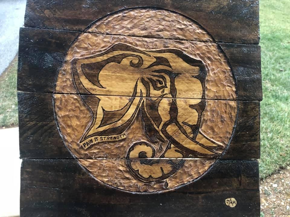 Tribal  elephant carved in relief on reclaimed pallet wood