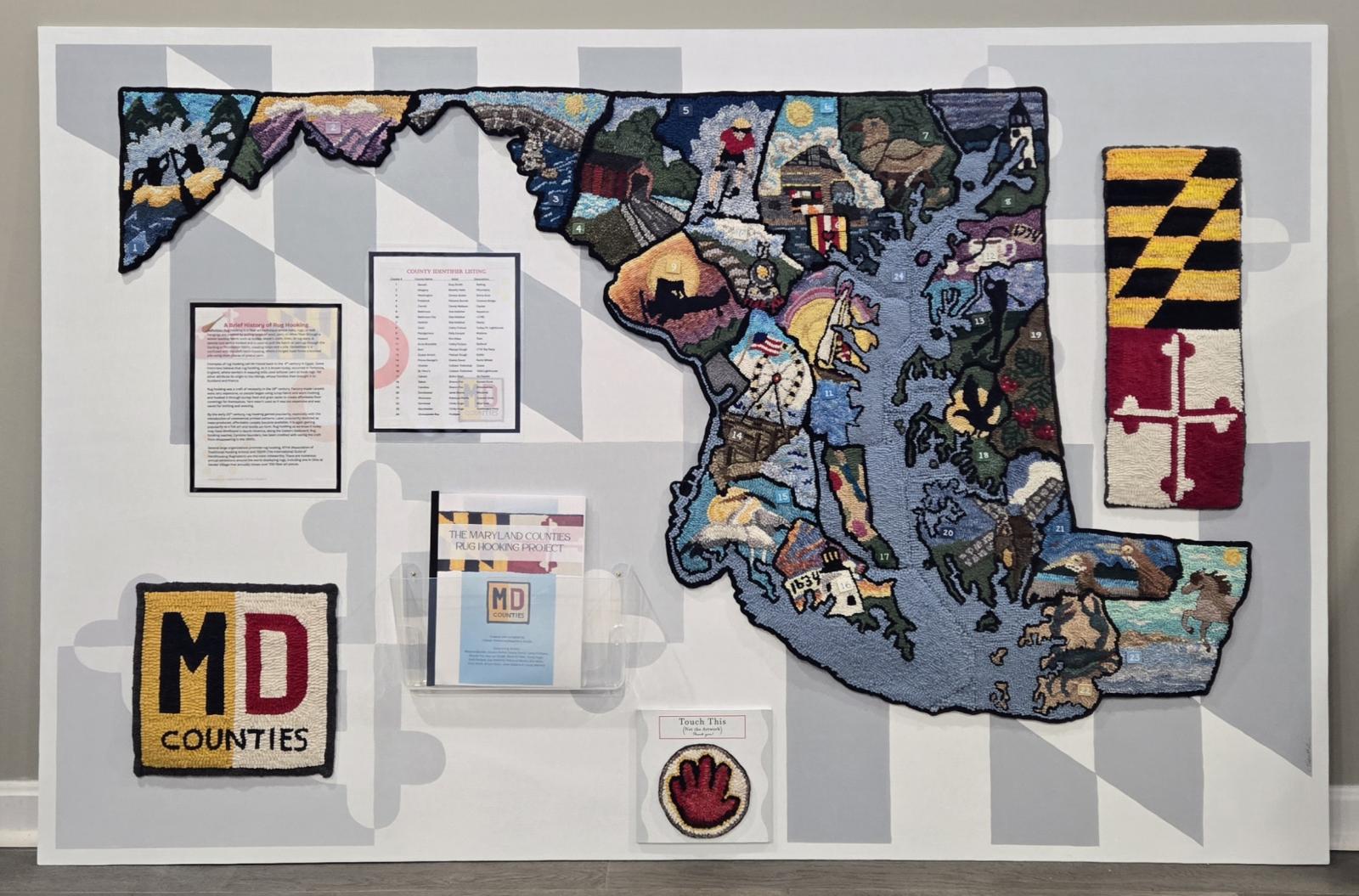 I designed this fiber art piece and brought together 15 other fiber artists to help hook the 23 counties of Maryland in wool using traditional rug hooking techniques. Each county's design tells a story about the area. The overall work includes a booklet that describes each artist, the county they created, and travel information about that county. The piece is intended to educate viewers about the state, the counties, and the age-old folkcraft of rug hooking. It is on tour to various locations around Maryland and several other states as well.