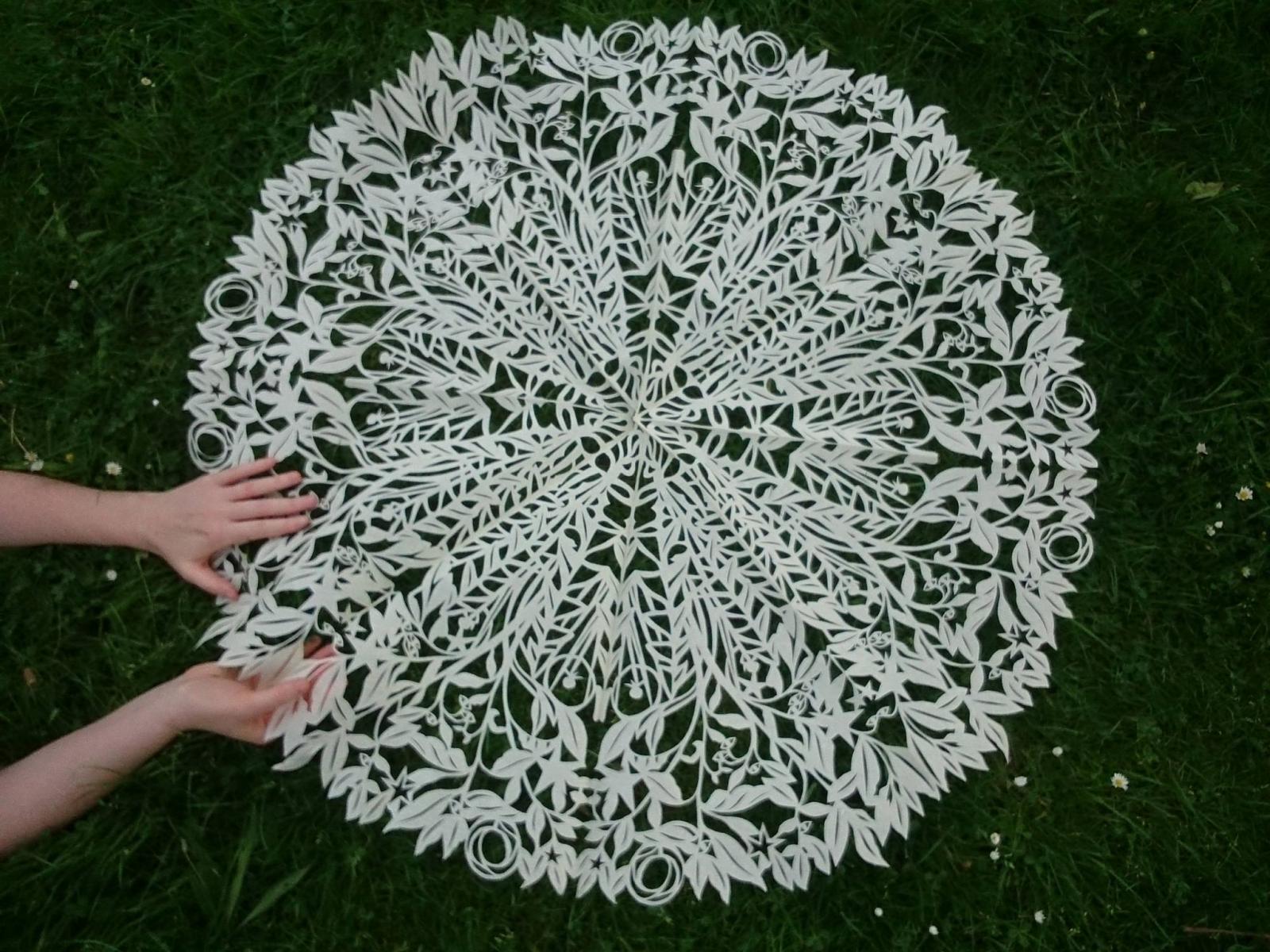 Video still featuring cut paper piece.
