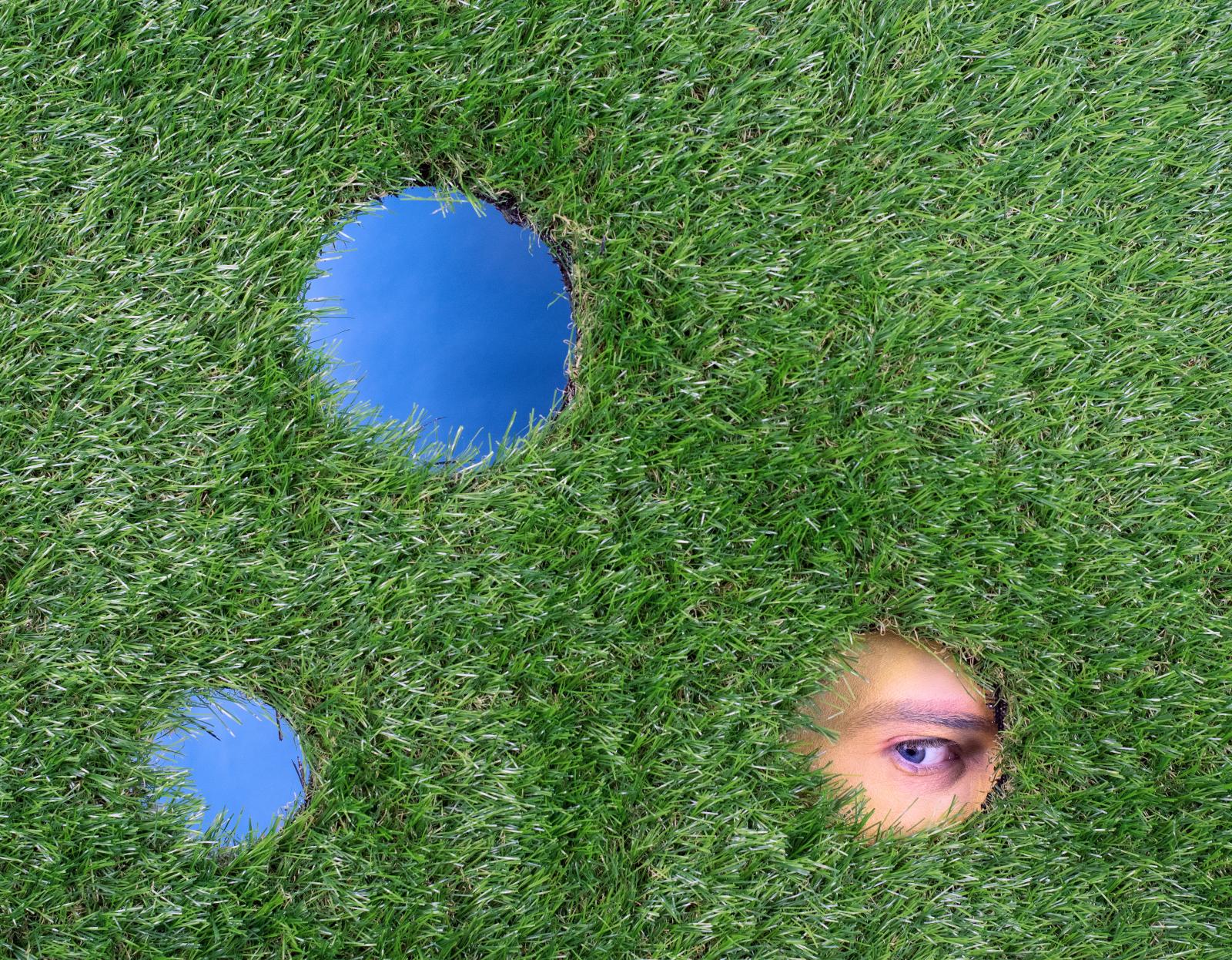 Digital photograph, set design created using astroturf and paper.