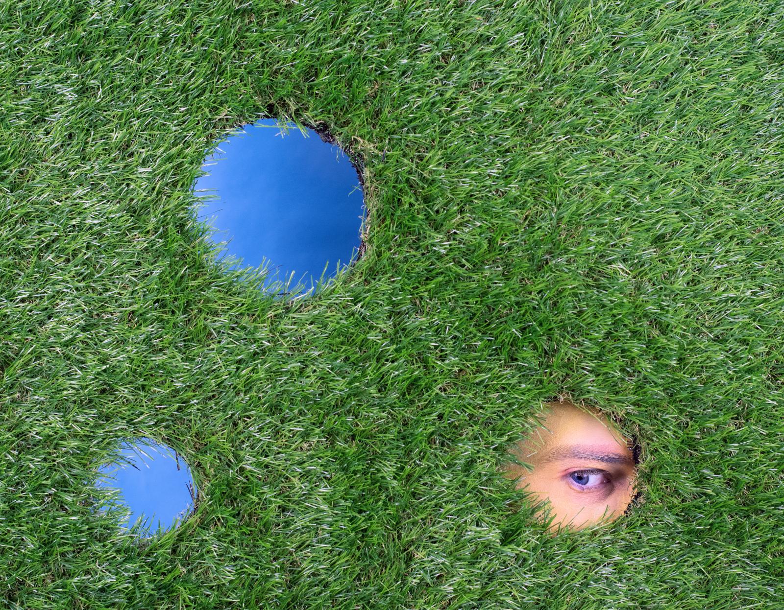 Digital photograph, set design created using astroturf and paper. 