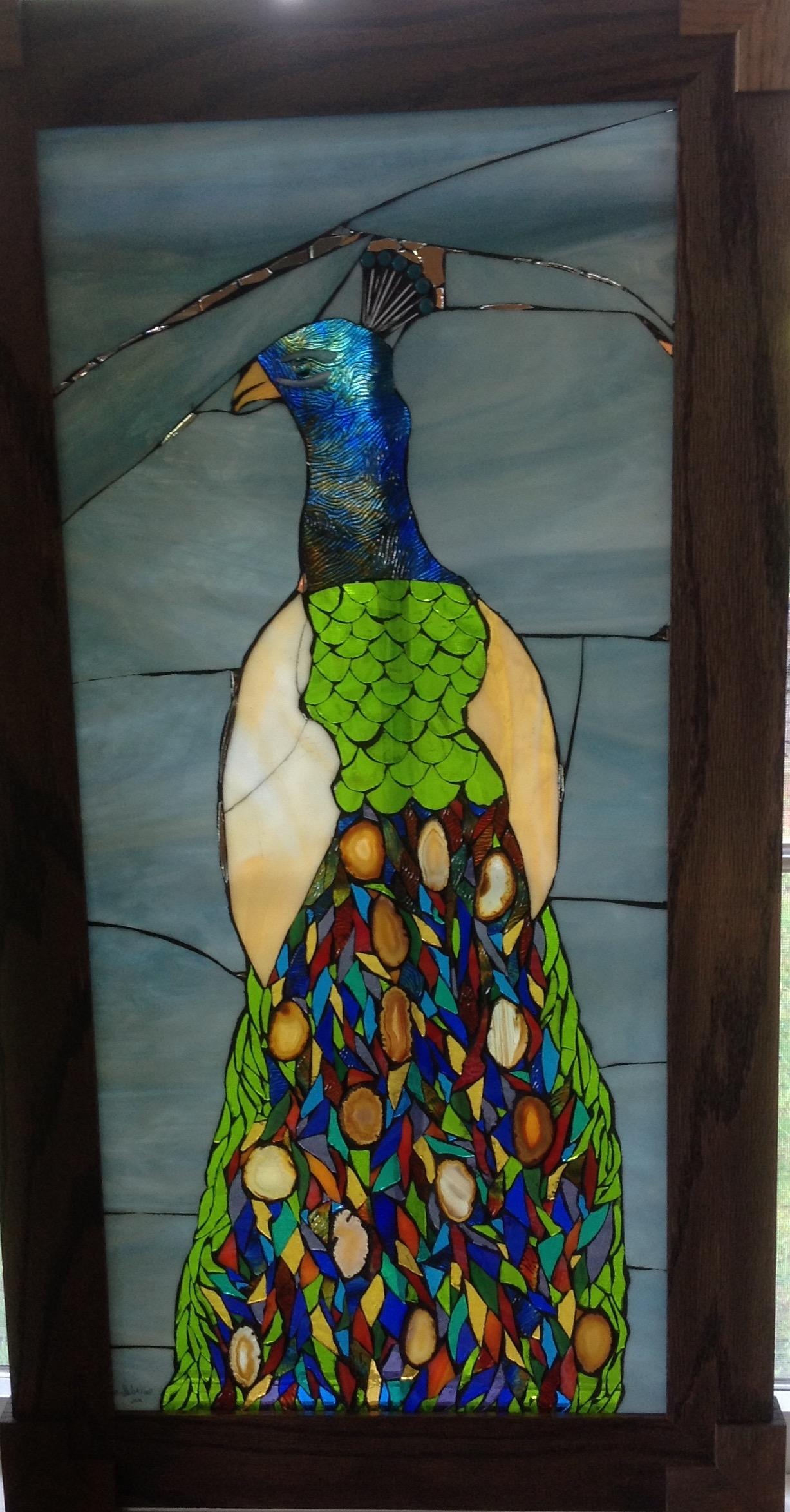 Mosaic peacock using stained and dichroic glass on glass in a custom wood frame