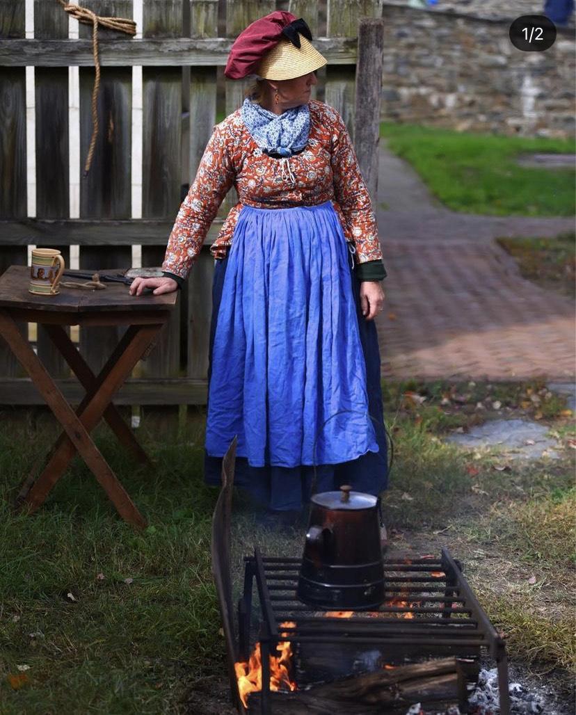 Photo taken by Masih Amadi of a lady dressed in historic clothing in Harper's Ferry West Virginia.