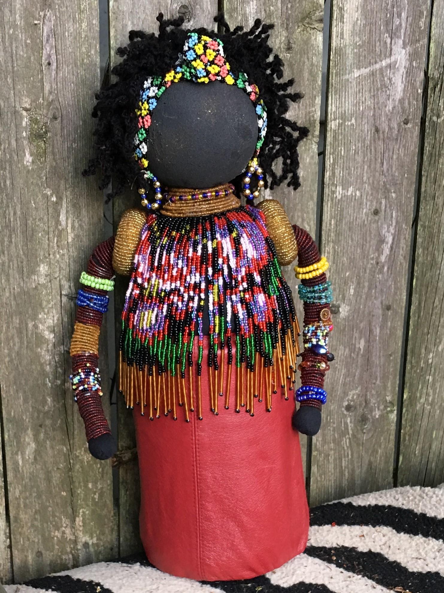 Beaded doll made from recycled plastic bottle and beads